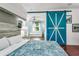This bright bedroom offers a view of the ensuite seating area through a decorative door at 2326 Florida Ave, Oviedo, FL 32765