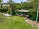 Scenic lakefront featuring a covered dock with comfortable seating, offering a tranquil retreat and serene lake views at 2326 Florida Ave, Oviedo, FL 32765