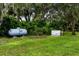 Exterior with generator, propane tank, and grassy yard at 2326 Florida Ave, Oviedo, FL 32765