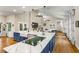 Modern kitchen with marble countertops, a center island, and an open view to the living room at 2326 Florida Ave, Oviedo, FL 32765