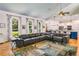 Open living room showcasing hardwood floors, modern furnishings, and seamless flow to the kitchen at 2326 Florida Ave, Oviedo, FL 32765