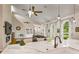 Sun-filled living room showcasing a marble countertop, hardwood floors, and modern decor at 2326 Florida Ave, Oviedo, FL 32765