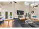Inviting living room with a fireplace, hardwood floors, and a seamless connection to the outdoor pool area at 2326 Florida Ave, Oviedo, FL 32765