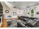 Bright living room featuring hardwood floors, vaulted ceiling, and ample natural light at 2326 Florida Ave, Oviedo, FL 32765