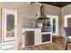 Well-equipped outdoor kitchen featuring a stainless steel grill, sink, and beverage center at 2326 Florida Ave, Oviedo, FL 32765