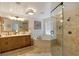 Well-appointed bathroom offers double vanity, soaking tub, and walk-in shower at 2349 Plantation Oak Dr, Orlando, FL 32824