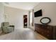 Bedroom featuring neutral paint, wood floors, and walk in closet at 2349 Plantation Oak Dr, Orlando, FL 32824