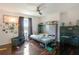 Bedroom featuring hardwood floors, pull down bed, and ceiling fan at 2349 Plantation Oak Dr, Orlando, FL 32824
