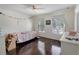 Bedroom featuring hardwood floors, modern windows, and white trim at 2349 Plantation Oak Dr, Orlando, FL 32824