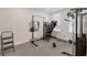 Home gym featuring rubber floor and various exercise machines at 2349 Plantation Oak Dr, Orlando, FL 32824