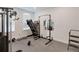 Home gym featuring rubber floor and various exercise machines at 2349 Plantation Oak Dr, Orlando, FL 32824