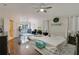 Spacious main bedroom boasts wood-look accent wall, dark floors, and sitting area with abundant natural light at 2349 Plantation Oak Dr, Orlando, FL 32824