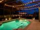 Screened in backyard pool with night lighting and outdoor gazebo at 2349 Plantation Oak Dr, Orlando, FL 32824