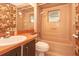 Bathroom with a standard shower/tub combination and vintage style sink with cabinetry and floral wallpaper at 2361 Kimberly Dr, Deltona, FL 32738