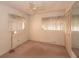 Bedroom with standard ceiling fan, neutral paint, and carpet flooring, and mirrored closet at 2361 Kimberly Dr, Deltona, FL 32738
