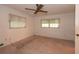 Empty bedroom showcases neutral walls, carpet flooring, ceiling fan, and natural lighting at 2361 Kimberly Dr, Deltona, FL 32738