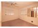 Bedroom with standard ceiling fan, neutral paint, and carpet flooring, and mirrored closet doors at 2361 Kimberly Dr, Deltona, FL 32738