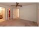 The bedroom features neutral tones, a ceiling fan, and ample natural light through windows at 2361 Kimberly Dr, Deltona, FL 32738