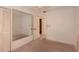 Bedroom with standard ceiling fan, neutral paint, and carpet flooring, and mirrored closet at 2361 Kimberly Dr, Deltona, FL 32738