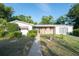 A charming home with mature landscaping and a well-manicured lawn, creating a welcoming curb appeal at 2361 Kimberly Dr, Deltona, FL 32738