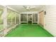 Enclosed lanai with a fan and many windows offering plenty of light at 2361 Kimberly Dr, Deltona, FL 32738