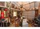 Cluttered garage with a wide variety of items, art, and equipment at 2361 Kimberly Dr, Deltona, FL 32738