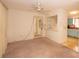 Spacious living room featuring doorway, ceiling fan, and view of the retro kitchen at 2361 Kimberly Dr, Deltona, FL 32738