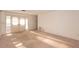 Sunlit living room featuring sliding glass doors and a view of the exterior, showcasing a bright and open space at 2361 Kimberly Dr, Deltona, FL 32738