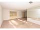 Bright living room with large windows and sliding doors, offering ample natural light and outdoor views at 2361 Kimberly Dr, Deltona, FL 32738
