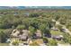Aerial view showcasing the property's location with mature trees and surrounding homes at 2409 Garbelia Ave, Orlando, FL 32817