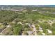 Aerial view of property, showcasing its location near lush greenery and distant buildings at 2409 Garbelia Ave, Orlando, FL 32817