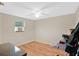 Bright bedroom featuring hardwood floors, natural light, and neutral walls at 2409 Garbelia Ave, Orlando, FL 32817
