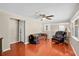 Cozy living room boasts hardwood floors and a ceiling fan, great for relaxing or entertaining guests at 2409 Garbelia Ave, Orlando, FL 32817