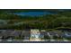 Beautiful aerial view of homes in a community, near a big lake and many trees at 2449 Southlawn Ln, Clermont, FL 34714