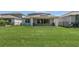 Spacious backyard with lush green grass and fencing, perfect for outdoor enjoyment at 2449 Southlawn Ln, Clermont, FL 34714