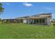 Wide shot of the lawn and exterior of the home at 2449 Southlawn Ln, Clermont, FL 34714