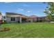 Expansive backyard featuring lush green grass, perfect for outdoor activities and relaxation at 2449 Southlawn Ln, Clermont, FL 34714
