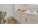 Modern bathroom with double vanity featuring white countertops, ample cabinet space, and modern fixtures at 2449 Southlawn Ln, Clermont, FL 34714