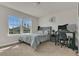 Bedroom featuring natural light, carpeted floor, and desk setup at 2449 Southlawn Ln, Clermont, FL 34714