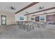 Spacious clubhouse interior with tables, chairs, and a bar area for community events at 2449 Southlawn Ln, Clermont, FL 34714