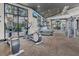 State-of-the-art fitness center with modern equipment and large windows overlooking the pool at 2449 Southlawn Ln, Clermont, FL 34714