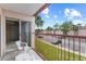Condo balcony overlooking the neighborhood, complete with outdoor seating at 2486 Citrus Club Ln # 408, Orlando, FL 32839