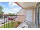Balcony includes chairs with views of the parking area at 2486 Citrus Club Ln # 408, Orlando, FL 32839