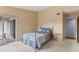 Cozy bedroom featuring neutral walls and access to a private balcony with a view at 2486 Citrus Club Ln # 408, Orlando, FL 32839