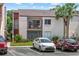 Condo exterior view, showcasing a private balcony with seating and convenient parking at 2486 Citrus Club Ln # 408, Orlando, FL 32839