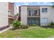 Condo exterior showcasing a private balcony and lush landscaping in a well-maintained community at 2486 Citrus Club Ln # 408, Orlando, FL 32839