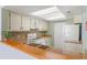 Traditional kitchen featuring white cabinetry, neutral countertops, and mosaic backsplash at 2486 Citrus Club Ln # 408, Orlando, FL 32839