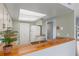 Bright kitchen with white appliances, a breakfast bar, and neutral countertops at 2486 Citrus Club Ln # 408, Orlando, FL 32839