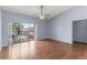 Bright living room with hardwood floors and sliding doors leading to a private balcony at 2486 Citrus Club Ln # 408, Orlando, FL 32839