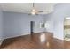 Spacious living area with hardwood floors, a ceiling fan, and natural light at 2486 Citrus Club Ln # 408, Orlando, FL 32839